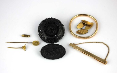 A gold topped and diamond set stick pin