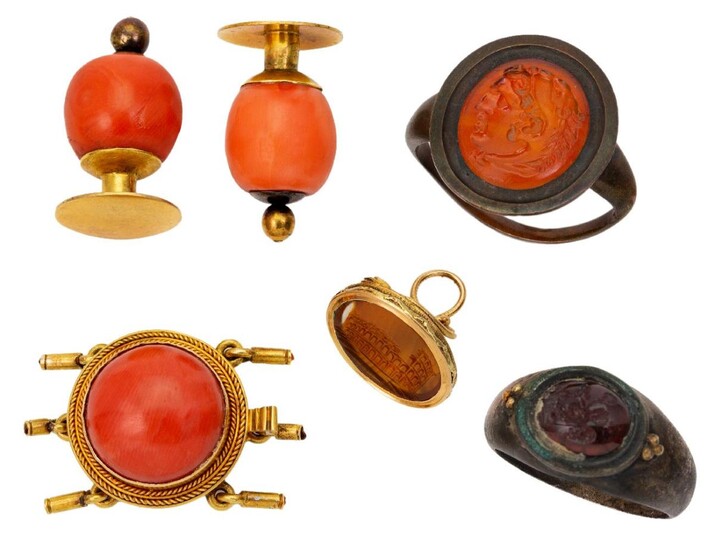 A group of jewellery, comprising: a Roman type silver and garnet intaglio ring, depicting the profile of an amorini; and antique glass intaglio ring depicting the profile of Hercules; an antique gold mounted carnelian intaglio fob seal, depicting...