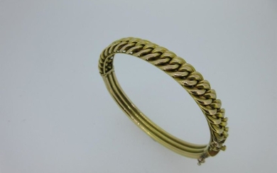 A hinged bangle with fixed chain link front stamped