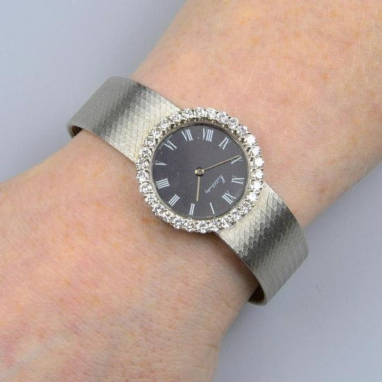 A lady's 18ct gold wrist watch, with black dial and