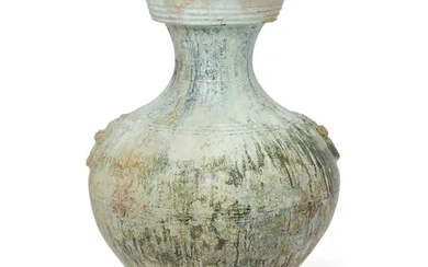 A large Chinese lead-green-glazed pear-shaped vase, hu Han dynasty With paired mock-embossed...