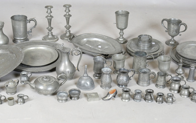 A large collection of mainly 19th century pewter, including three large chargers, various plates, fo