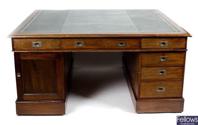 A large early twentieth century mahogany twin pedestal partners desk.