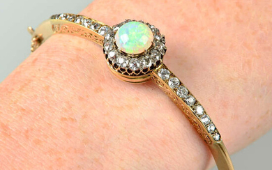 A late 19th century 15ct gold opal and old-cut diamond hinged bangle.