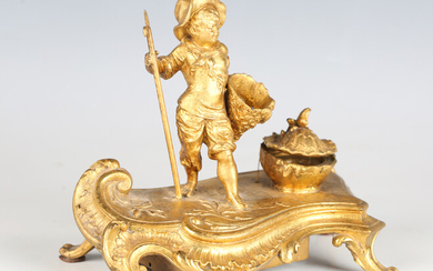 A late 19th century gilt painted spelter novelty musical inkstand, the Rococo style base with figura