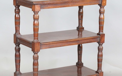 A late Victorian mahogany three-tier whatnot with ring turned legs and castors, height 92cm, width 7
