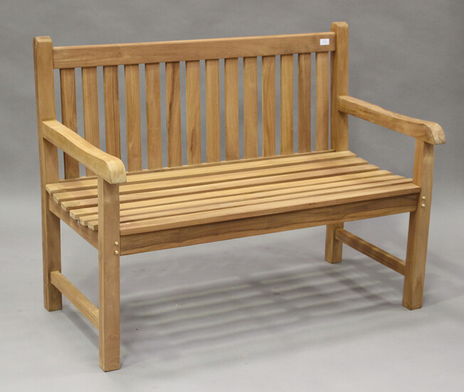 A modern hardwood slatted garden bench, height 93cm, width 120cm, depth 65cm.