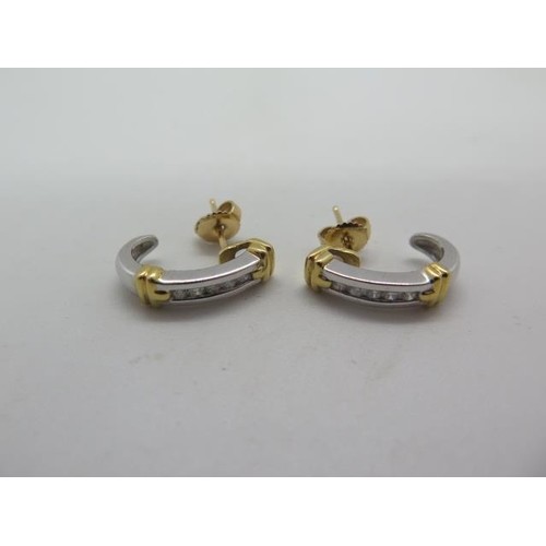 A pair of 18ct yellow and white gold banded diamond earrings...