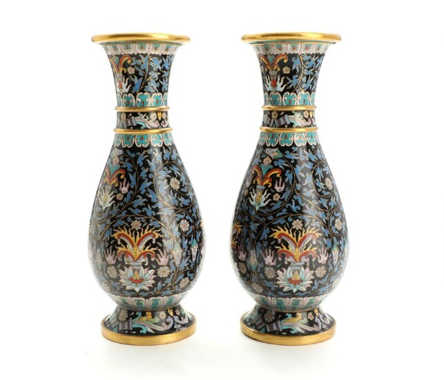 A pair of Chinese cloisonné enamel vases, decorated in colours with flowers and foliage. 20th century. H. 23 cm. (2)