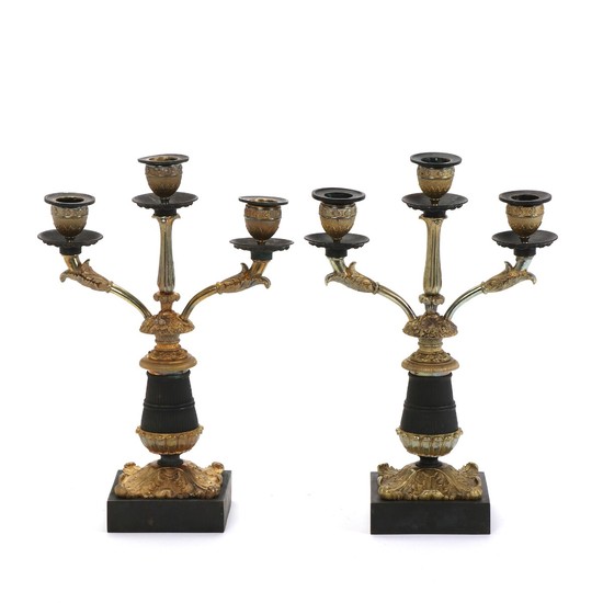 A pair of French 19th century Napoleon III gilt and patinated bronze candelabra each for three candles. H. 30 cm. (2)