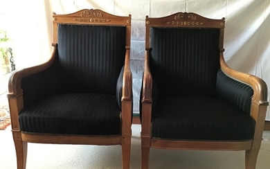 A pair of French mahogany armchairs, carved with gilded wood ornament. Charles X style, circa 1900. H. 98. (2)