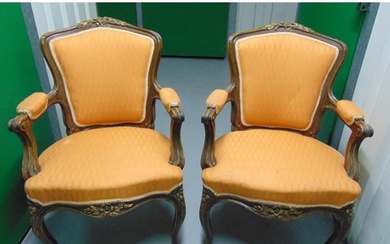 A pair of French style mahogany upholstered armchairs on cab...