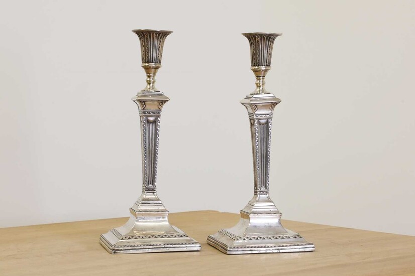A pair of George III silver table candlesticks