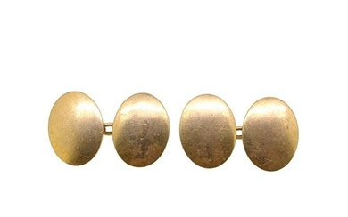 A pair of cufflinks, plain polished oval shaped panels, approximately 19 x 14.5mm, chain connection