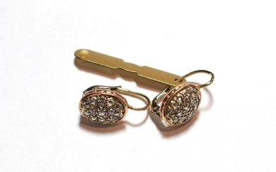A pair of diamond cluster earrings, the oval plaque set...