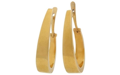 A pair of gold earrings