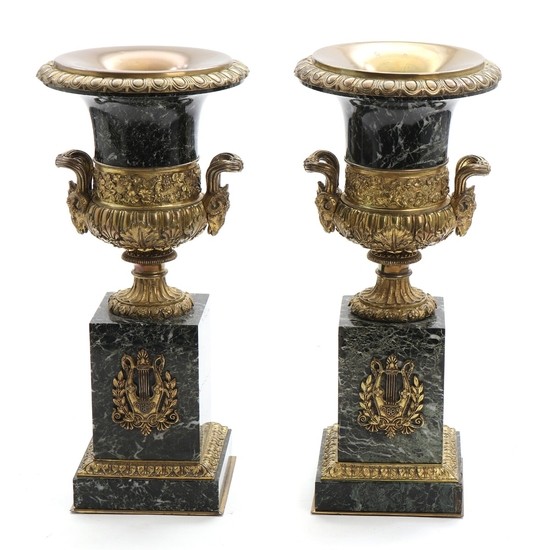 A pair of green marble urns with gilt bronze mounting. C. 1900. H. 43 cm. (2)