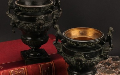 A pair of late 19th century dark patinated bronze urns, cast...