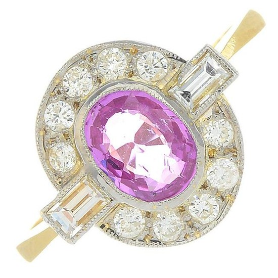 A pink sapphire and diamond cluster ring.Sapphire