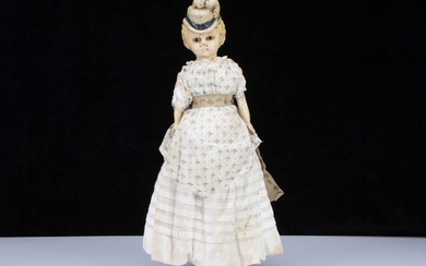 A rare German 19th century wax over composition shoulder head doll with moulded hat