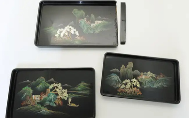 A set of three graduated black lacquer trays, 20th century, each painted...