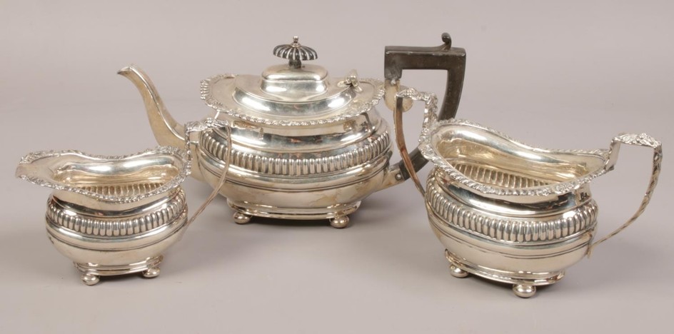 A silver three piece tea set to include teapot, milk jug, tw...