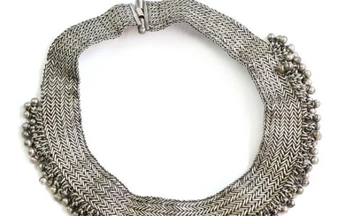 A silver woven collar style necklace