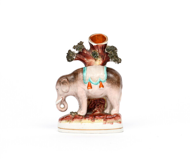 A small Staffordshire spill vase figure of an elephant 19th century