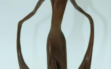 A stylised bronze of a female bearing a conjoined