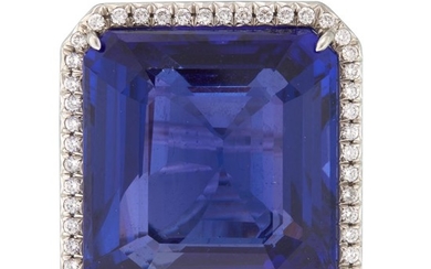 A tanzanite, diamond, and platinum ring centering a square-cut...
