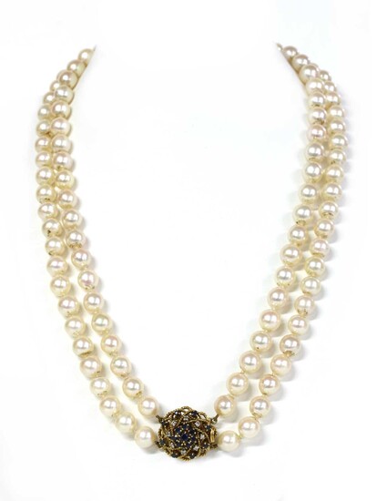 A two row uniform cultured pearl necklace with sapphire and diamond clasp