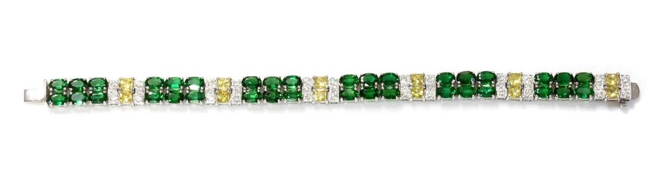 A white gold two row chrome diopside, yellow sapphire and diamond line bracelet