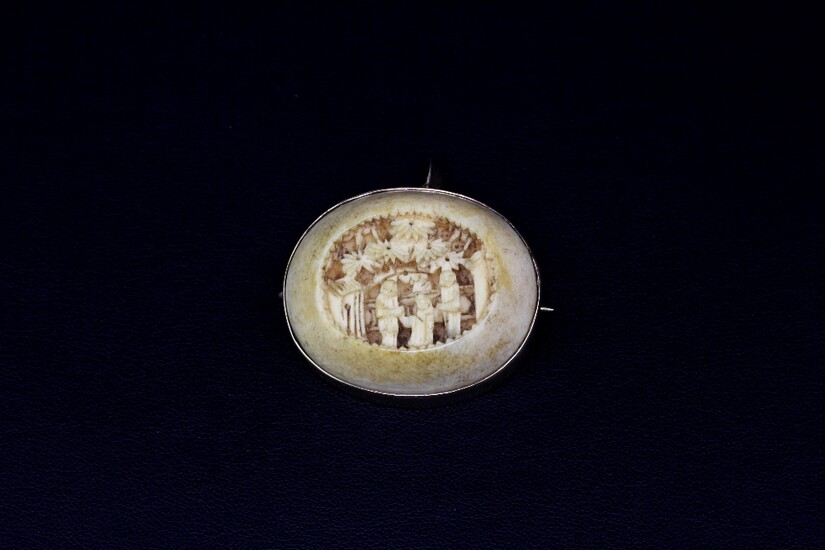 A yellow metal (tested minimum 9ct gold) mounted antique carved Chinese ivory pendant/brooch, W. 3.5cm.
