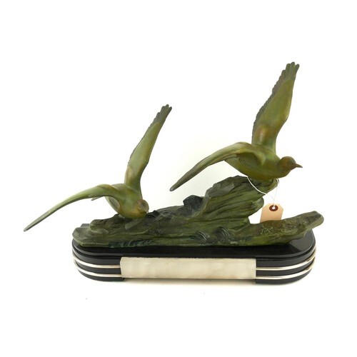 AN ART DECO SPELTER AND MARBLE BIRD SCULPTURE Two spelter co...