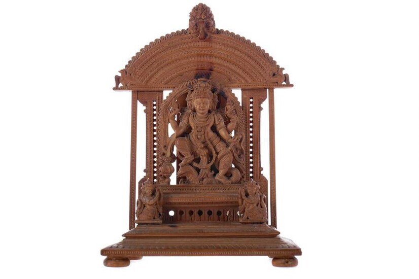 AN EARLY 20TH CENTURY INDIAN CARVED SANDALWOOD FIGURE OF A DEITY