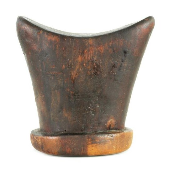 AN EARLY AFRICAN HARDWOOD HEAD REST with shaped top and