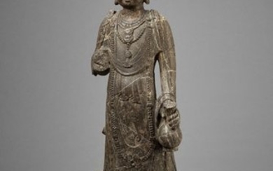 AN EXCEPTIONAL LARGE LIMESTONE FIGURE OF A BODHISATTVA,...