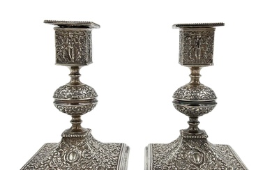 AN UNUSUAL PAIR OF SILVER ENGLISH HALLMARKED CANDLESTICKS DECORATED...