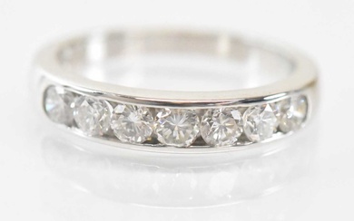 An 18ct white gold diamond half eternity ring set with...