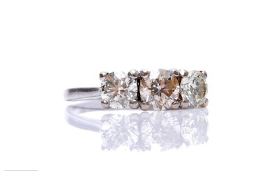 An 18ct white gold diamond three stone ring, brilliant cut c...