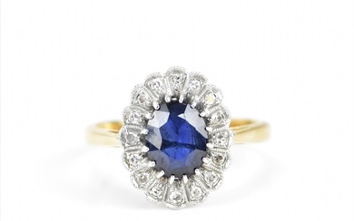 An 18ct yellow gold, platinum, diamond and sapphire cluster ...