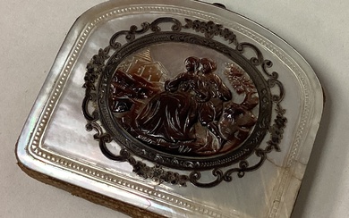 An 18th Century silver and MOP purse with carved scene to centre.