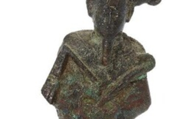 An Egyptian bronze fragmentary figure of Osiris Late Period, circa 664-525 B.C Wearing an atef crown, holding a crook and flail, 7cm high Provenance: The Estate of costume designer Anthony Powell (1935-2021).