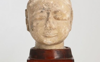 An Indian carved stone Jaina head