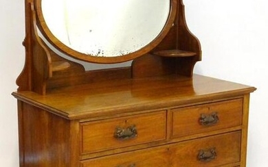 An early 20thC walnut Maple & Co dressing table with an