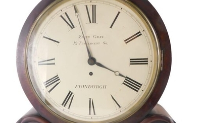An early Victorian figured mahogany mantel clock, the drum...