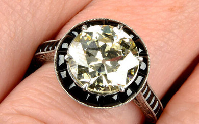 An old-cut diamond dress ring, with onyx surround and shoulders.