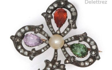 Brooch " Trèfle " in yellow gold and silver, set with rose-cut diamonds, a tourmaline, an amethyst, a citrine and a cultured pearl. Dimensions : 4 x 3.8 cm. P. Brut : 14 g.