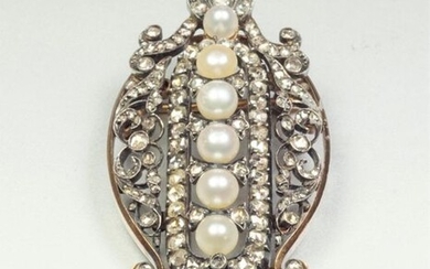 Brooch in silver (800/oo) and 18K (750/oo) yellow gold, centered...