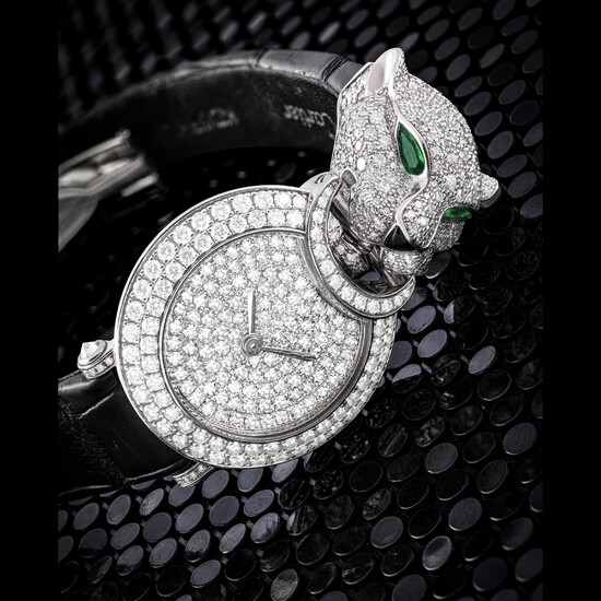 CARTIER. A LADY’S ATTRACTIVE 18K WHITE GOLD, DIAMOND, EMERALD AND ONYX-SET WRISTWATCH HIGH JEWELLERY PANTHERE CAPTIVE DE CARTIER MODEL